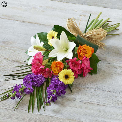 Vibrant Scented Sheaf - A bright, beautiful and fragrant combination of lilies, roses and stocks. Also featuring alstroemeria and aspidistra.

The image shows Large Size

Please note: for seasonal and other supply reasons, we may occasionally substitute some of the blooms shown in the image. We will always try to be true to the bouquet's colour coordination, style, and shape and guarantee to give you the full value paid. If you have any queries, please email or call us and we would be delighted to confirm availability and explain alternatives. See the 'Contact Us' section.