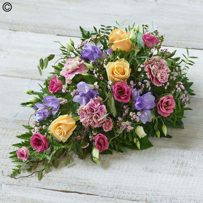 Scented Pastels Spray - A profusion of fragrant pastel blooms arranged in a teardrop shape. Features scented freesia, peach roses, and natural willow and grass.

The image shows Large Size

Please note: for seasonal and other supply reasons, we may occasionally substitute some of the blooms shown in the image. We will always try to be true to the bouquet's colour coordination, style, and shape and guarantee to give you the full value paid. If you have any queries, please email or call us and we would be delighted to confirm availability and explain alternatives. See the 'Contact Us' section.