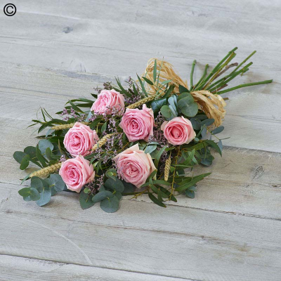 Simple Rose Sheaf - Six large-headed roses are presented with aralia leaves, french ruscus and eucalyptus. Hand tied to create this simple, classic rose sheaf.

Please note: for seasonal and other supply reasons, we may occasionally substitute some of the blooms shown in the image. We will always try to be true to the bouquet's colour coordination, style, and shape and guarantee to give you the full value paid. If you have any queries, please email or call us and we would be delighted to confirm availability and explain alternatives. See the 'Contact Us' section.