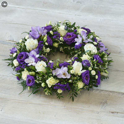 Scented Wreath - One of our most popular designs, this beautiful profusion of blooms features fragrant freesias.

The image shows Large Size

Please note: for seasonal and other supply reasons, we may occasionally substitute some of the blooms shown in the image. We will always try to be true to the bouquet's colour coordination, style, and shape and guarantee to give you the full value paid. If you have any queries, please email or call us and we would be delighted to confirm availability and explain alternatives. See the 'Contact Us' section.