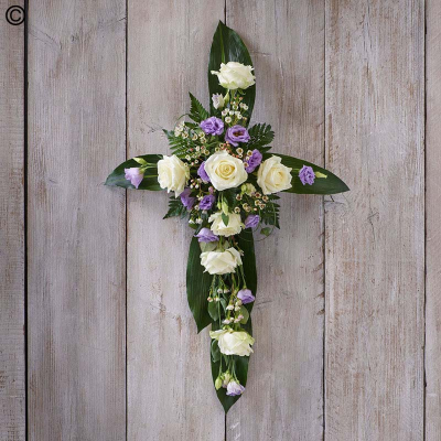 Lilac and White Cross - A profusion of white blooms, this elegant wreath features the finest hydrangeas, fragrant rosemary and dried lagarus 'bunny tails'.

The image shows Large Size

Please note: for seasonal and other supply reasons, we may occasionally substitute some of the blooms shown in the image. We will always try to be true to the bouquet's colour coordination, style, and shape and guarantee to give you the full value paid. If you have any queries, please email or call us and we would be delighted to confirm availability and explain alternatives. See the 'Contact Us' section.