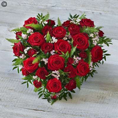 Rose Heart - Featuring stunning garden roses, delicate lilac lisianthus and scented rosemary, this heart tribute is full of beautiful tones.CAN ALSO BE MADE IN DIFFERENT COLOURS.

Please note: for seasonal and other supply reasons, we may occasionally substitute some of the blooms shown in the image. We will always try to be true to the bouquet's colour coordination, style, and shape and guarantee to give you the full value paid. If you have any queries, please email or call us and we would be delighted to confirm availability and explain alternatives. See the 'Contact Us' section.