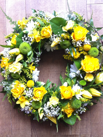 Classic Wreath Yellow & Cream - A classic selection of flowers including irises, carnations and spray chrysanthemums nestled into this traditional circular wreath by Go Dutch Flowers.

Please Note: The image relates to the standard variant.