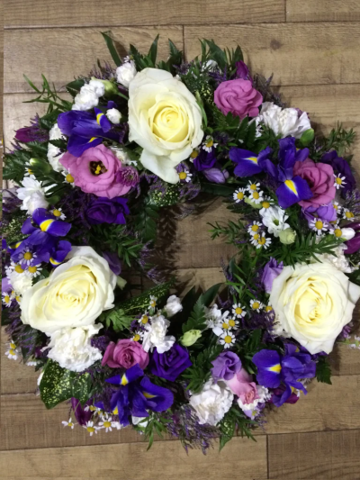 Wreath Pink & Lilac - Lilies and large-headed roses are nestled amongst lisianthus along with eryngium and foliage in this circular wreath by Go Dutch Flowers.

The image shows Large Size

Please note: for seasonal and other supply reasons, we may occasionally substitute some of the blooms shown in the image. We will always try to be true to the bouquet's colour coordination, style, and shape and guarantee to give you the full value paid. If you have any queries, please email or call us and we would be delighted to confirm availability and explain alternatives. See the 'Contact Us' section.