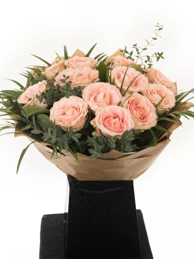 Cupid Pink Roses - Long-stemmed Pink roses are beautifully arranged, wrapped, and delivered in our signature bag with flower food and care instructions