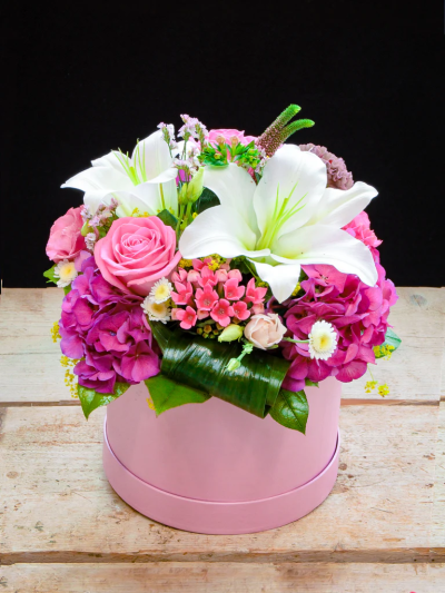 Pink and White Hatbox - A charming arrangement of luxurious flowers in a pink & white colourway. Made to impress in a stylish hatbox.

Please note: for seasonal and other supply reasons, we may occasionally substitute some of the blooms shown in the image. We will always try to be true to the bouquet's colour coordination, style, and shape and guarantee to give you the full value paid. If you have any queries, please email or call us and we would be delighted to confirm availability and explain alternatives. See the 'Contact Us' section.