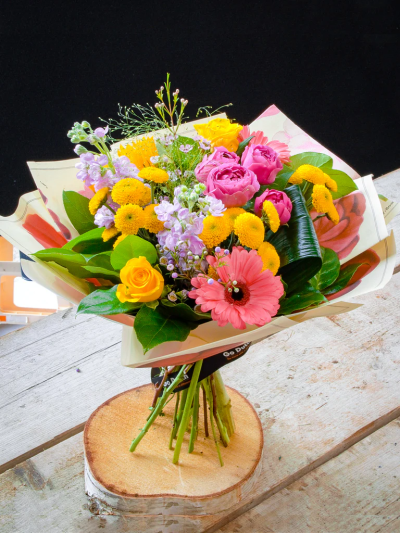 Sunrise Glow Bouquet - Inspired by the vibrant morning sunshine, this pretty hand-tied bouquet is bursting with colour, texture and variety. In this bouquet, we included lots of favourites including sunflowers, pink gerberas, yellow roses, Santini chrystants finished with waxflowers, spray roses and greeneries.

The image shows Large Size

Please note: for seasonal and other supply reasons, we may occasionally substitute some of the blooms shown in the image. We will always try to be true to the bouquet's colour coordination, style, and shape and guarantee to give you the full value paid. If you have any queries, please email or call us and we would be delighted to confirm availability and explain alternatives. See the 'Contact Us' section.
