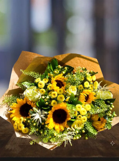 Sunny Sunflower - This striking bright bouquet is bursting with warmth and radiant colour. This bouquet is certain to brighten someones day. delivered in water in our signature paper bag with flower food and full care instructions.
The image shows Large Size

Please note: for seasonal and other supply reasons, we may occasionally substitute some of the blooms shown in the image. We will always try to be true to the bouquet's colour coordination, style, and shape and guarantee to give you the full value paid. If you have any queries, please email or call us and we would be delighted to confirm availability and explain alternatives. See the 'Contact Us' section.
