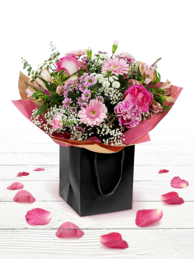 Rosemary - A pink themed hand-tied created in a complimentary gift bag or box. A special gift they’ll remember for years to come.

The image shows Large Size

Please note: for seasonal and other supply reasons, we may occasionally substitute some of the blooms shown in the image. We will always try to be true to the bouquet's colour coordination, style, and shape and guarantee to give you the full value paid. If you have any queries, please email or call us and we would be delighted to confirm availability and explain alternatives. See the 'Contact Us' section.