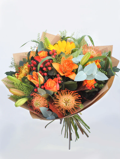 Orange Glow Bouquet - This exclusive Floral Bouquet combines autumn with beautiful orange, yellow and red flowers. The freshness and quality show what our fresh flowers are known for.
 

The image shows Large Size

Please note: for seasonal and other supply reasons, we may occasionally substitute some of the blooms shown in the image. We will always try to be true to the bouquet's colour coordination, style, and shape and guarantee to give you the full value paid. If you have any queries, please email or call us and we would be delighted to confirm availability and explain alternatives. See the 'Contact Us' section.