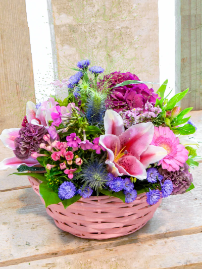 Grandma's Favorite Basket - A pretty collection of purple & pink flowers skilfully arranged in a beautiful basket to send your message wonderfully.

Please note: for seasonal and other supply reasons, we may occasionally substitute some of the blooms shown in the image. We will always try to be true to the bouquet's colour coordination, style, and shape and guarantee to give you the full value paid. If you have any queries, please email or call us and we would be delighted to confirm availability and explain alternatives. See the 'Contact Us' section.
