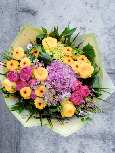Sunset Luxury Hand-tied - Beautifully presented with a balance of contrasting colours and textures, this glorious summer gift is ready to take pride of place on arrival.

Please note: for seasonal and other supply reasons, we may occasionally substitute some of the blooms shown in the image. We will always try to be true to the bouquet's colour coordination, style, and shape and guarantee to give you the full value paid. If you have any queries, please email or call us and we would be delighted to confirm availability and explain alternatives. See the 'Contact Us' section.