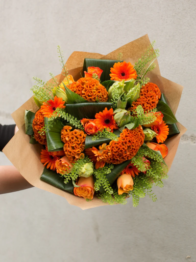 Rustic Orange Harvest - The rich rustic oranges and lush greens in this sumptuous bouquet give it a real warmth and character. This classic combination of carefully selected roses, Gerbera's and celosia are sure to delight someone special – this is a gift to really impress.

The image shows Large Size

Please note: for seasonal and other supply reasons, we may occasionally substitute some of the blooms shown in the image. We will always try to be true to the bouquet's colour coordination, style, and shape and guarantee to give you the full value paid. If you have any queries, please email or call us and we would be delighted to confirm availability and explain alternatives. See the 'Contact Us' section.