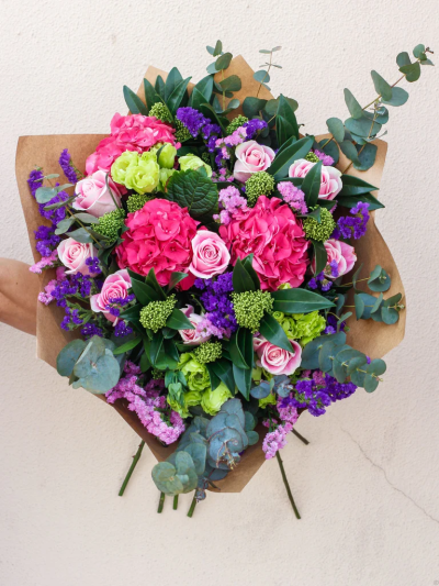 Adele Deluxe Hand-tied - Designed by Flowers Now, a delicate selection of Pink Roses, Green Lisianthus, Skimmia, Complimented with Statice and finished with fresh hydrangea tied together with Seasonal foliages.

The image shows Large Size

Please note: for seasonal and other supply reasons, we may occasionally substitute some of the blooms shown in the image. We will always try to be true to the bouquet's colour coordination, style, and shape and guarantee to give you the full value paid. If you have any queries, please email or call us and we would be delighted to confirm availability and explain alternatives. See the 'Contact Us' section.
