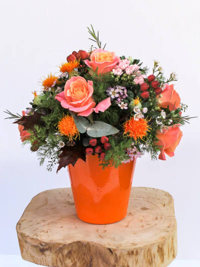 Marigold Flower Arrangement - All perfectly arranged by our experienced Dutch master Florists, this autumnal flower arrangement comes with a nice autumnal-themed flower pot. (Pot May Vary)

Please note: for seasonal and other supply reasons, we may occasionally substitute some of the blooms shown in the image. We will always try to be true to the bouquet's colour coordination, style, and shape and guarantee to give you the full value paid. If you have any queries, please email or call us and we would be delighted to confirm availability and explain alternatives. See the 'Contact Us' section.