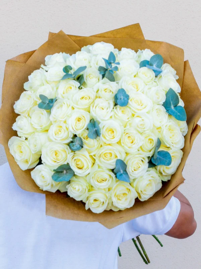 Total Love White Roses - To express a love that knows no bounds, send a bouquet that's equally as limitless. This exquisite display is the perfect way to send your love to someone special. Beautifully arranged, wrapped and delivered in our signature bag with flower food and care instructions.
