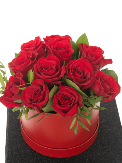 Red Roses Hatbox - A stunning Hat Box, over-flowing with a stunning red roses. We do guarantee that your specific arrangement will be fresh, beautiful and that your recipient will love it!