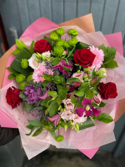 Charm Bouquet - This beautifully designed hand-tied bouquet would make anybody happy! This is definitely a gift from heaven. 

The image shows Large Size

Please note: for seasonal and other supply reasons, we may occasionally substitute some of the blooms shown in the image. We will always try to be true to the bouquet's colour coordination, style, and shape and guarantee to give you the full value paid. If you have any queries, please email or call us and we would be delighted to confirm availability and explain alternatives. See the 'Contact Us' section.