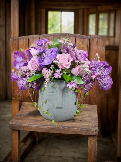 The Vanda Paradise - New Vanda Arrangement

Please note: for seasonal and other supply reasons we may, from time to time, substitute some of the blooms shown in the image. We will always try to be true to the colour co-ordination, style and shape of the bouquet and will always guarantee to give you the full value paid. If you have any queries, please email or call us and we would be delighted to confirm availability and or explain alternatives. See 'contact us' section.